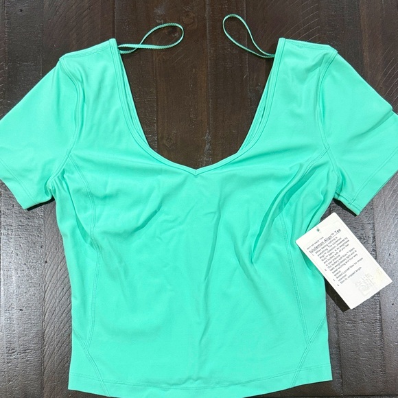 Lululemon Athletica Aqua V-Neck Blouse. Unworn. Size 4. - Picture 1 of 4
